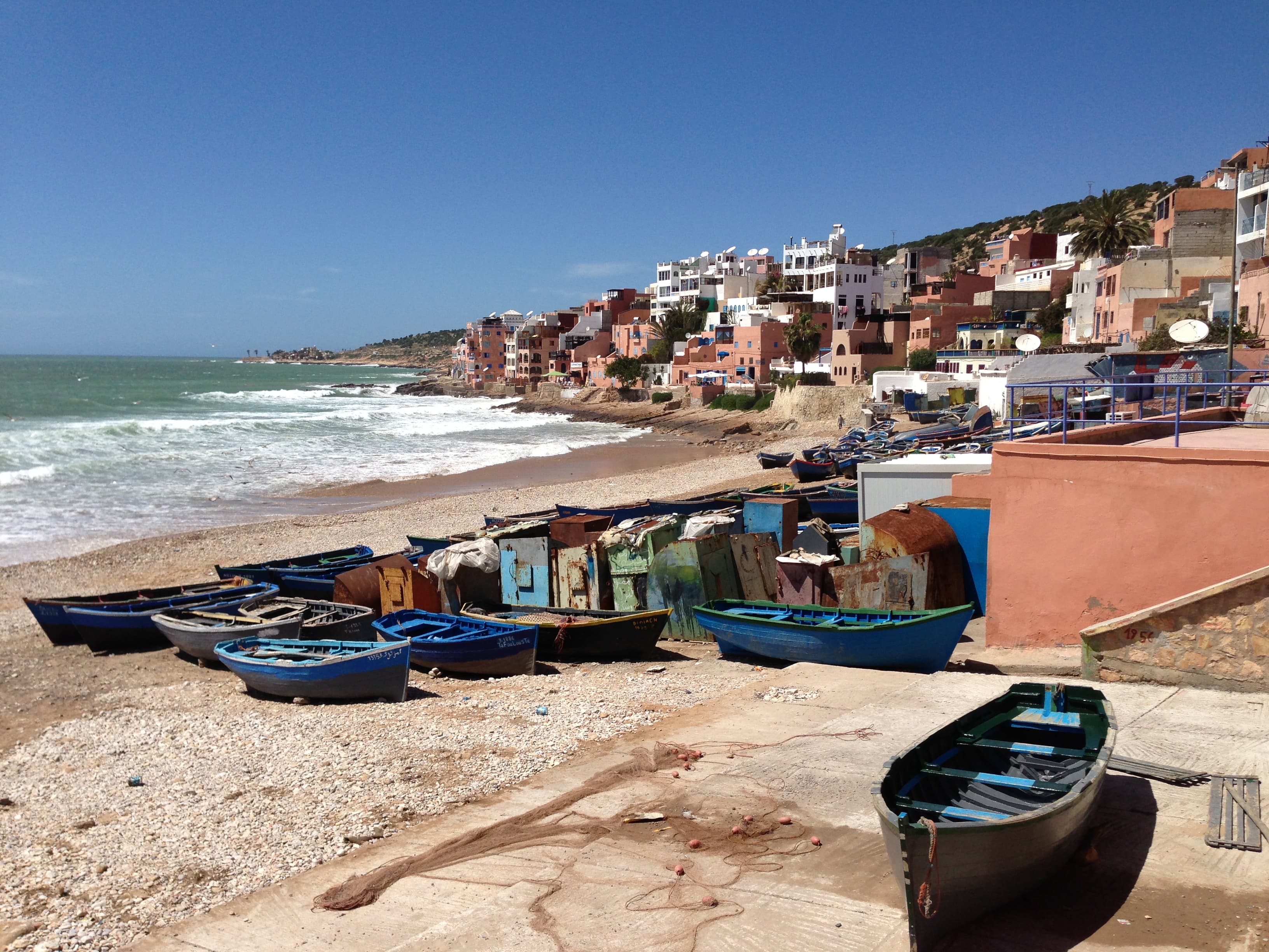 Taghazout beach and fishing boats Blue fishing boats on the beach in Taghazout, Morocco